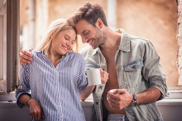 couple drinking morning coffee deeply in love