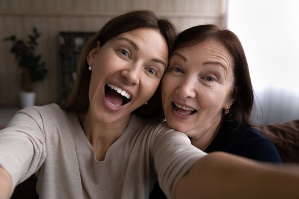 05 mom and daughter selfie smiling joking together
