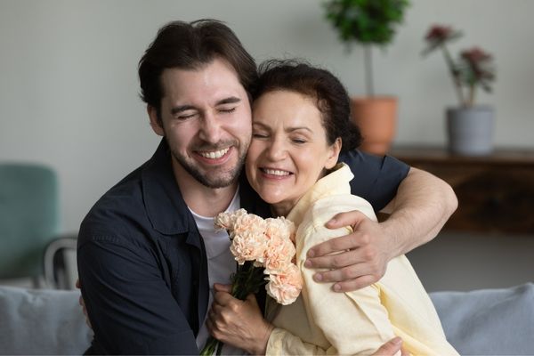 mother-son-in-law-happy-hugging-flowers