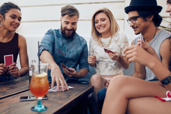 relaxing playing drinking games cards