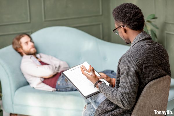 Man lying sofa Psychological Session with Psychologist counsellor