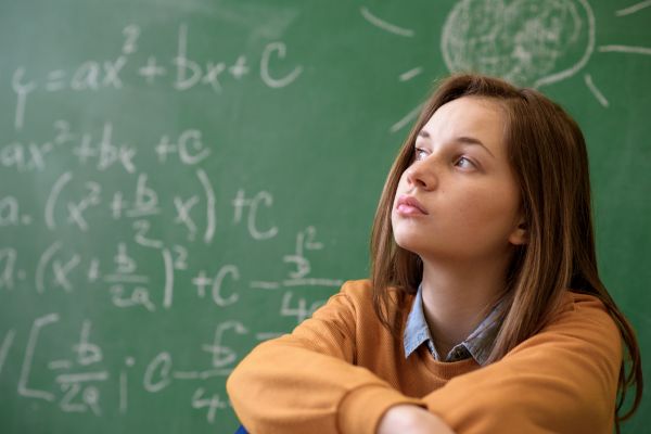Teen girl in math class overwhelmed anxiety stressed
