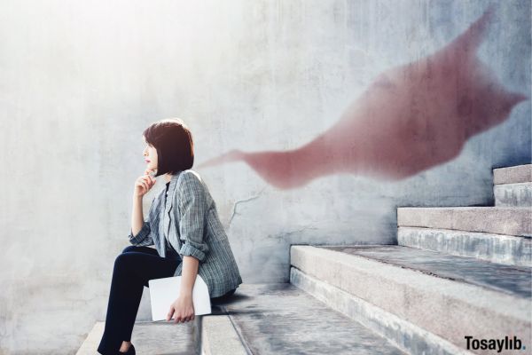 Woman sitting on Stair thinking Superhero Blanket Shadow on wall