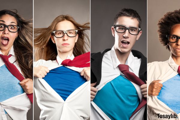 students opening shirts showing superhero sides