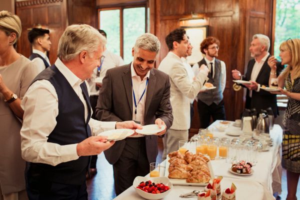 networking breakfast professional businessmen exchanging conversation