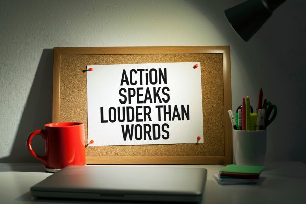 action speaks louder than words board mug and paper