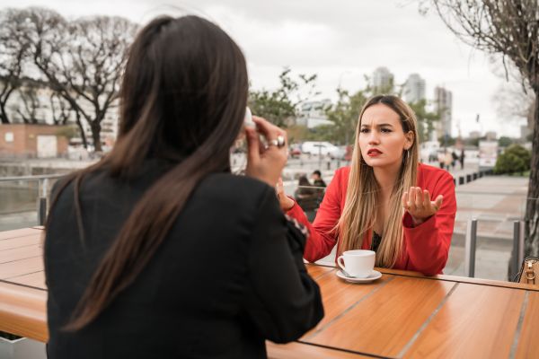 angry friend complaining flaws pointing coffee shop