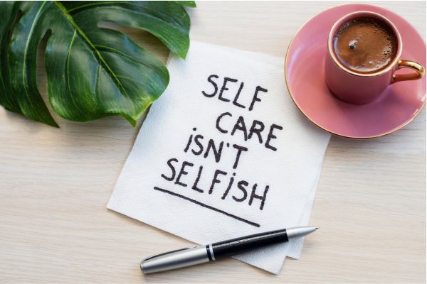 self care is not selfish inspirational reminder on napkin coffee pen