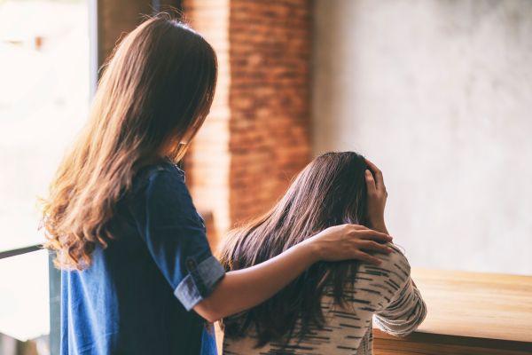 woman giving encouragement to her depressed friend