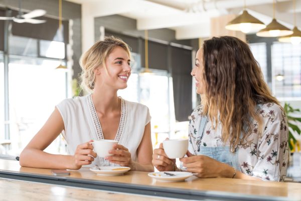 woman talking problems or flaws with good intention over coffee